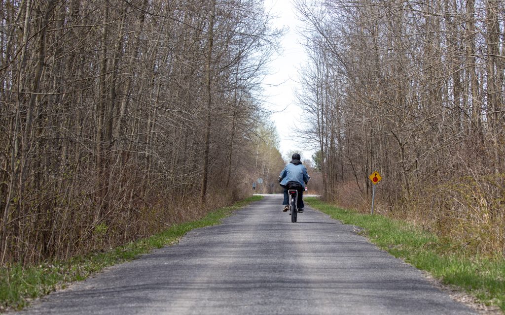 A lone cyclist rides the trail south of 33 in Bloomfield.
